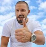 black haired man in white crew neck t shirt