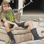 full length of man sitting outdoors